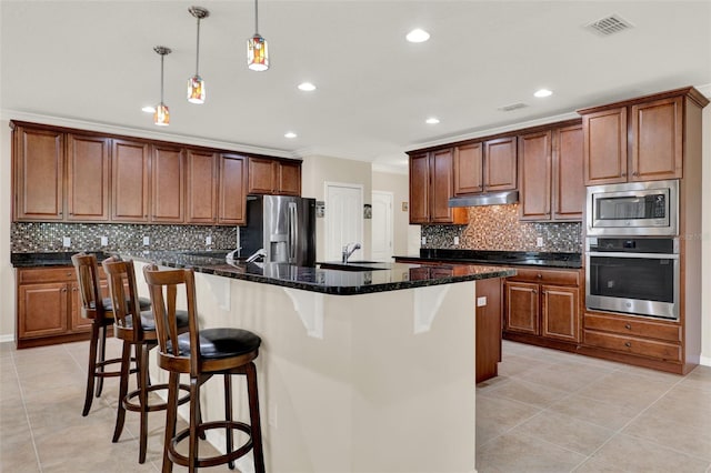 kitchen with a kitchen breakfast bar, stainless steel appliances, visible vents, light tile patterned floors, and crown molding