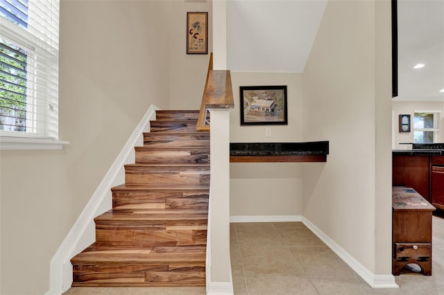 stairway with recessed lighting, tile patterned floors, and baseboards