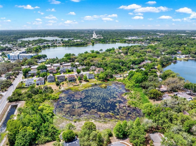 birds eye view of property featuring a residential view and a water view