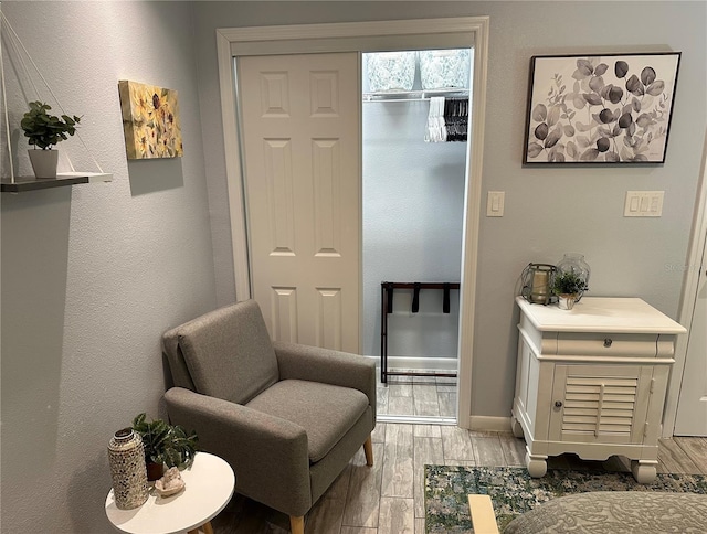 4800 S Semoran Blvd Unit 101, Orlando, FL 32822 - sitting room featuring wood finished floors and baseboards