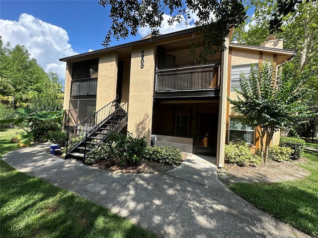 4800 S Semoran Blvd Unit 101, Orlando, FL 32822 - view of building exterior with stairs