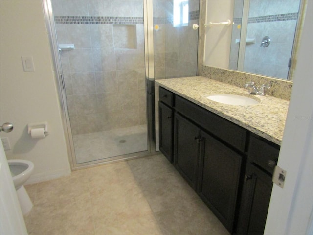 bathroom featuring a shower stall, toilet, vanity, and baseboards