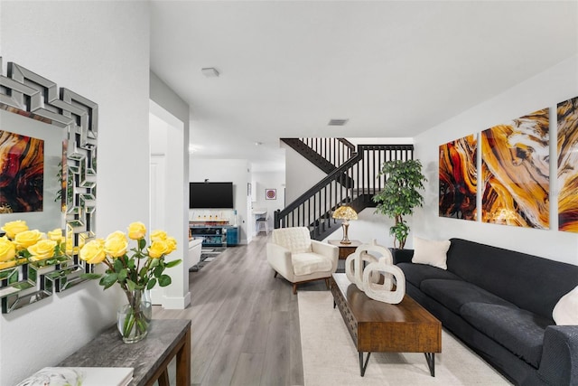 549 NE 206th Ln, Miami, FL 33179 - living area with stairway, visible vents, and wood finished floors