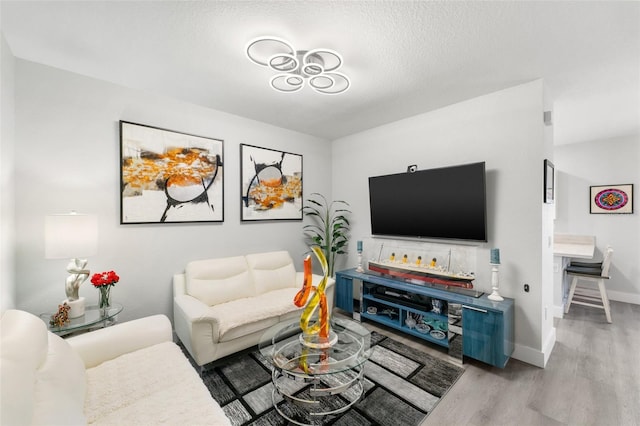 549 NE 206th Ln, Miami, FL 33179 - living room featuring light wood-type flooring and baseboards