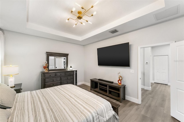 549 NE 206th Ln, Miami, FL 33179 - bedroom featuring baseboards, visible vents, an inviting chandelier, and a tray ceiling