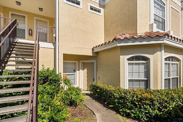 676 Sandy Neck Ln Unit 102, Altamonte Springs, FL 32714 - doorway to property with stucco siding and a tiled roof