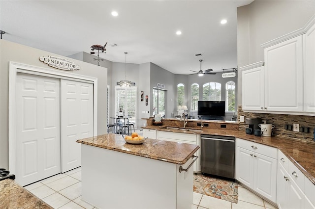 kitchen featuring stainless steel dishwasher, a sink, light tile patterned flooring, a ceiling fan, and recessed lighting