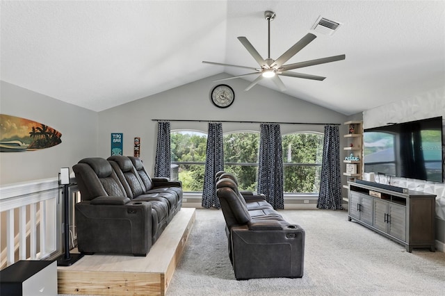living area with a ceiling fan, vaulted ceiling, and light colored carpet