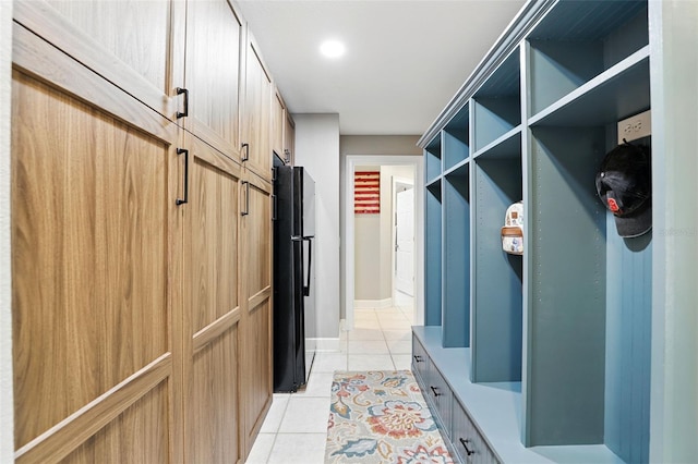 mudroom with light tile patterned floors