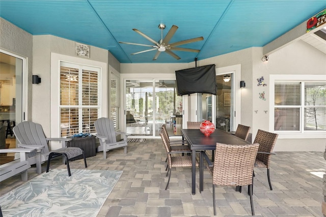 view of patio / terrace featuring a ceiling fan and outdoor dining space