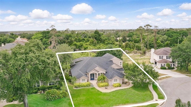 aerial view of property and surrounding area featuring property parcel outlined
