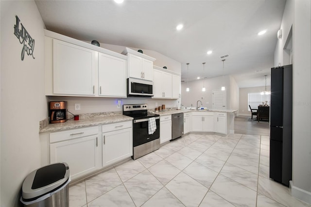 8137 Merano Ave, Fort Pierce, FL 34951 - kitchen featuring recessed lighting, a peninsula, white cabinets, appliances with stainless steel finishes, and a sink