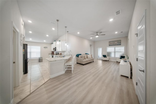 8137 Merano Ave, Fort Pierce, FL 34951 - living room with recessed lighting, light wood finished floors, visible vents, and a ceiling fan