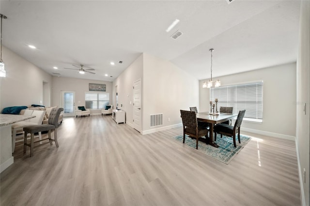 8137 Merano Ave, Fort Pierce, FL 34951 - dining area featuring visible vents, baseboards, light wood finished floors, and ceiling fan with notable chandelier