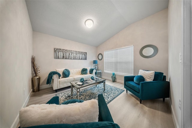 8137 Merano Ave, Fort Pierce, FL 34951 - living area with baseboards, a textured ceiling, wood finished floors, and lofted ceiling