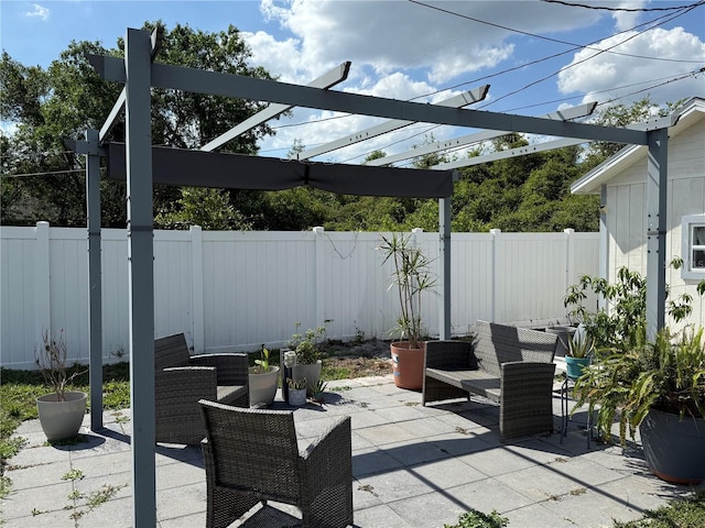 view of patio / terrace with a fenced backyard, an outdoor hangout area, and a pergola