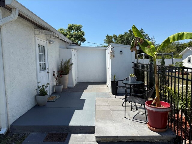view of patio with fence