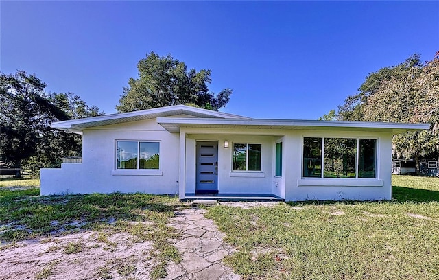 407 Sheryl Dr, Deltona, FL 32738 - view of front of property featuring a front yard and stucco siding