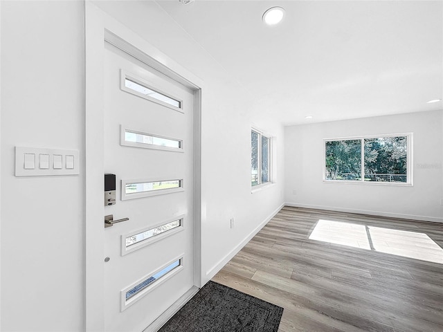 407 Sheryl Dr, Deltona, FL 32738 - foyer with recessed lighting, wood finished floors, and baseboards
