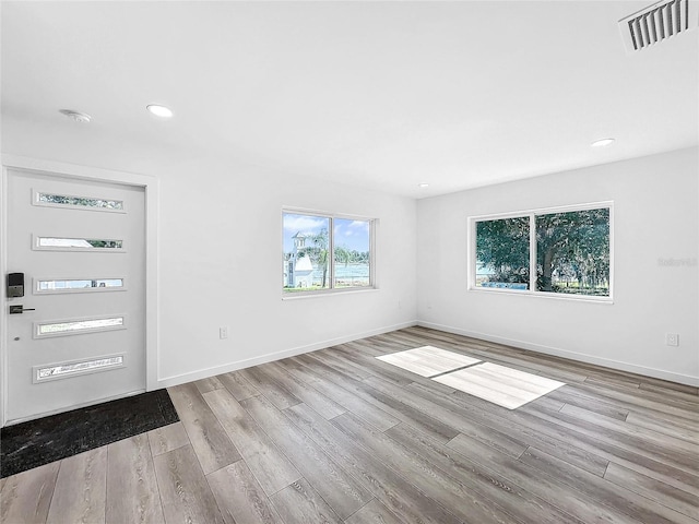 407 Sheryl Dr, Deltona, FL 32738 - foyer entrance with recessed lighting, wood finished floors, visible vents, and baseboards