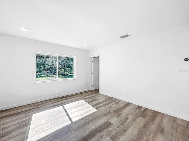 407 Sheryl Dr, Deltona, FL 32738 - spare room featuring visible vents, baseboards, wood finished floors, and recessed lighting
