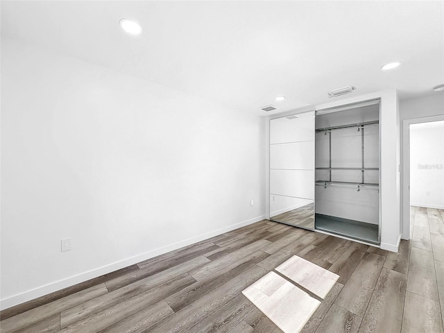 407 Sheryl Dr, Deltona, FL 32738 - unfurnished bedroom featuring recessed lighting, wood finished floors, and visible vents