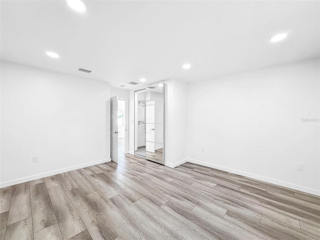 407 Sheryl Dr, Deltona, FL 32738 - spare room with baseboards, wood finished floors, and recessed lighting