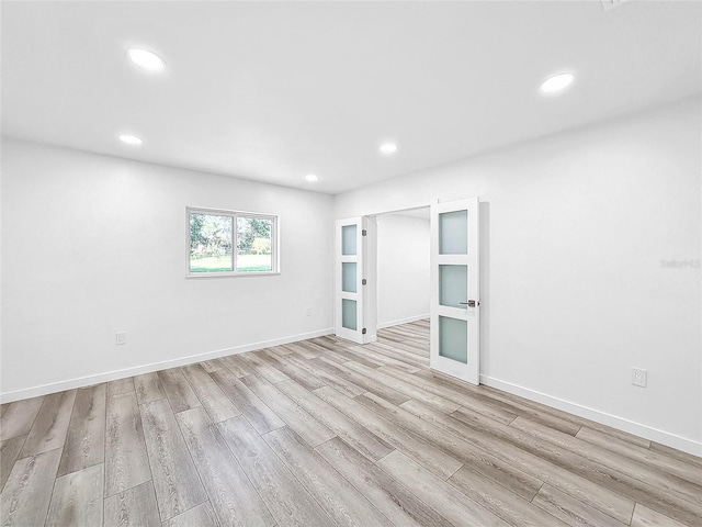 407 Sheryl Dr, Deltona, FL 32738 - spare room featuring baseboards, light wood finished floors, and recessed lighting