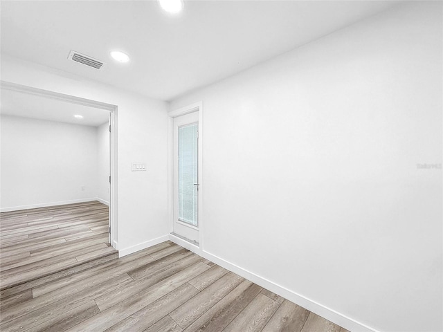 407 Sheryl Dr, Deltona, FL 32738 - unfurnished room featuring baseboards, wood finished floors, visible vents, and recessed lighting