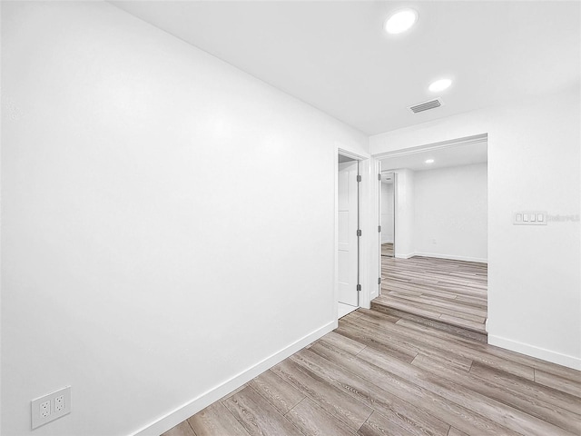 407 Sheryl Dr, Deltona, FL 32738 - hallway with baseboards, wood finished floors, and visible vents