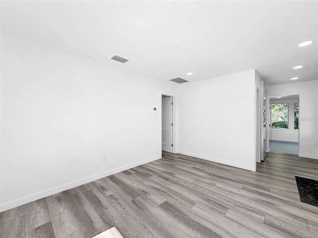 407 Sheryl Dr, Deltona, FL 32738 - unfurnished room with baseboards, wood finished floors, visible vents, and recessed lighting