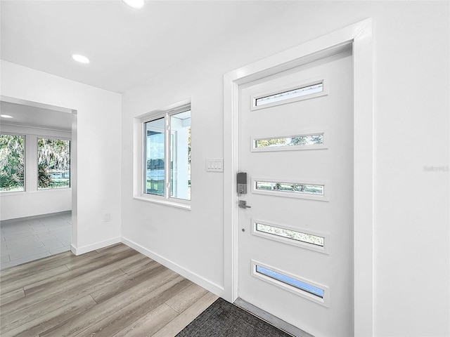 407 Sheryl Dr, Deltona, FL 32738 - foyer featuring baseboards, light wood-style floors, and recessed lighting