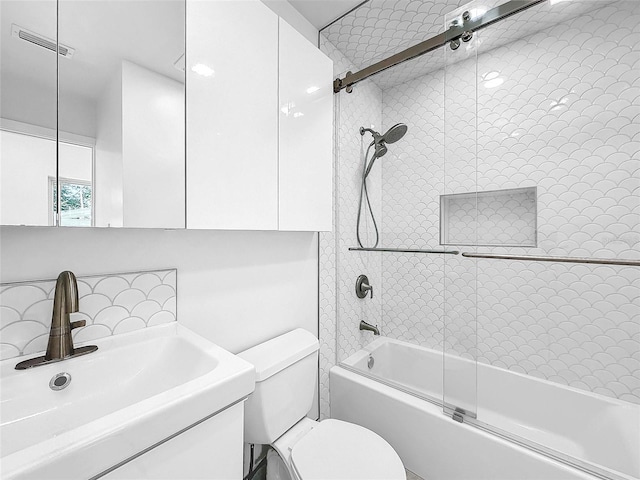 407 Sheryl Dr, Deltona, FL 32738 - full bath featuring shower / bath combination with glass door, visible vents, toilet, and vanity