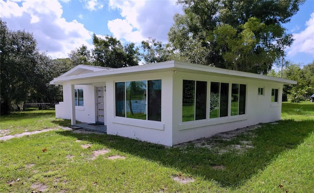 407 Sheryl Dr, Deltona, FL 32738 - view of side of property featuring a yard and stucco siding