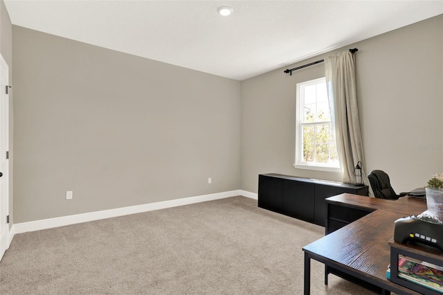 office space featuring baseboards and carpet