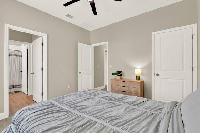 bedroom featuring ceiling fan, baseboards, and visible vents