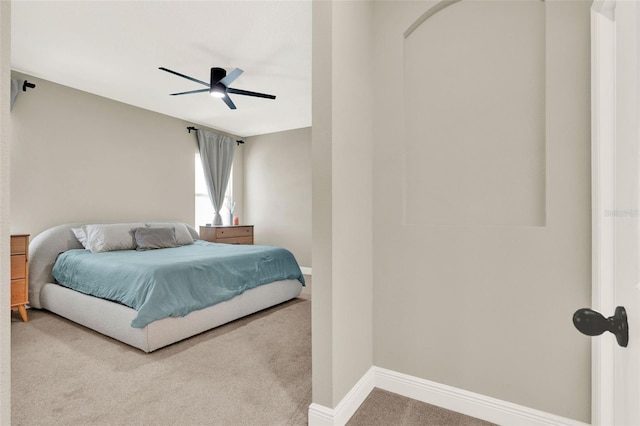 bedroom with baseboards, a ceiling fan, and carpet floors