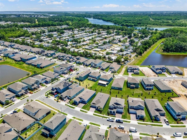 bird's eye view with a residential view and a water view