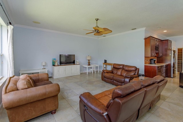 4556 Serna Ave, Malabar, FL 32950 - living room featuring ceiling fan, ornamental molding, plenty of natural light, and light tile patterned flooring