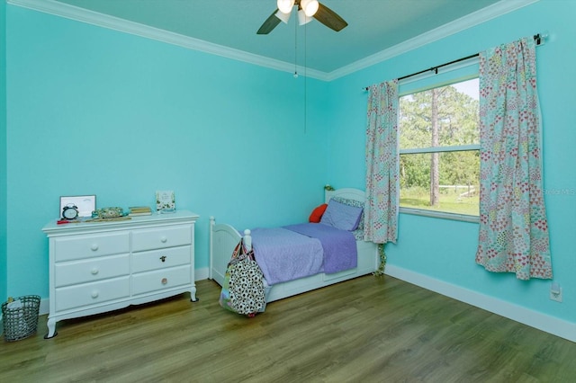 4556 Serna Ave, Malabar, FL 32950 - bedroom with ornamental molding, wood finished floors, and a ceiling fan