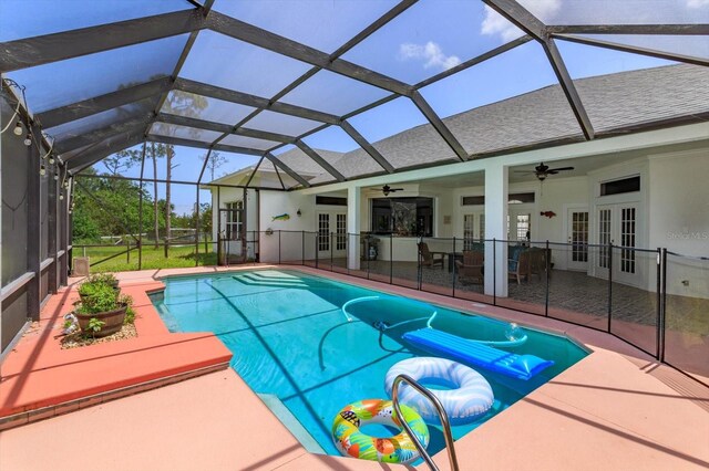 4556 Serna Ave, Malabar, FL 32950 - outdoor pool featuring french doors, a ceiling fan, a patio area, and a lanai