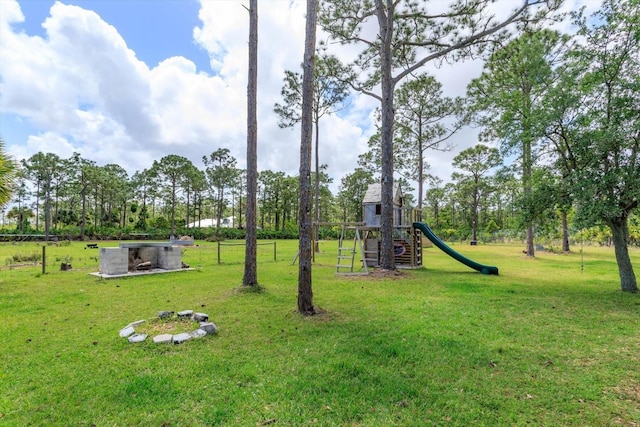 4556 Serna Ave, Malabar, FL 32950 - view of grassy yard with a playground