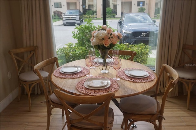 dining area with light wood-style flooring