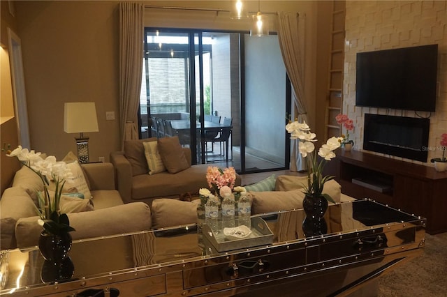 living room with a large fireplace and built in shelves