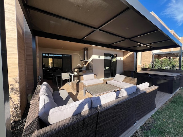 view of patio with a hot tub and an outdoor hangout area