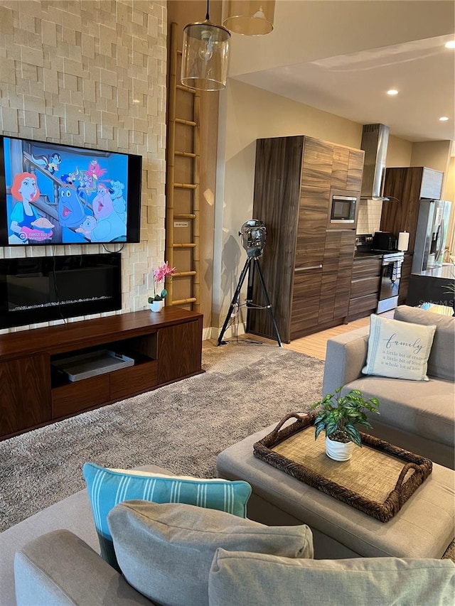living area featuring light carpet, recessed lighting, and built in shelves