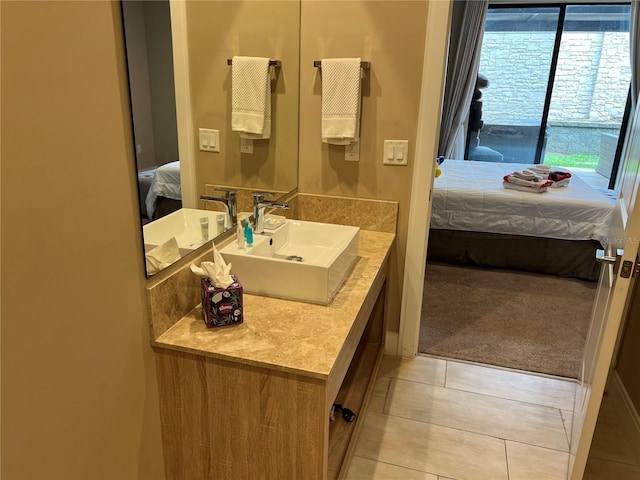 ensuite bathroom featuring tile patterned floors, ensuite bathroom, and vanity