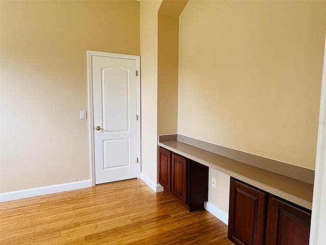 702 Palenci Ct, Winter Springs, FL 32708 - unfurnished office with baseboards, arched walkways, and light wood-style floors