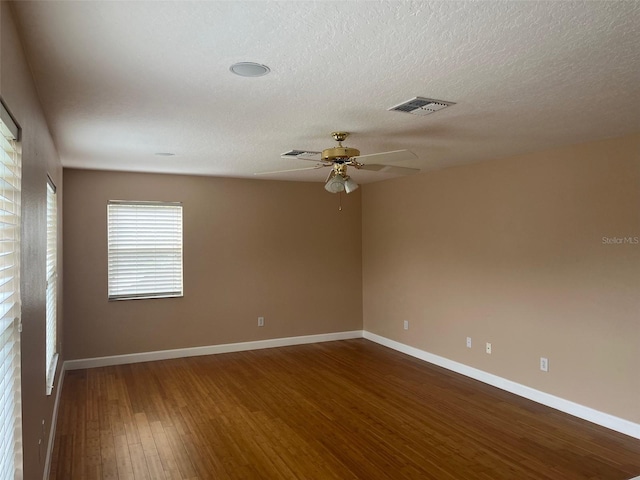 702 Palenci Ct, Winter Springs, FL 32708 - unfurnished room featuring baseboards, a textured ceiling, visible vents, ceiling fan, and wood finished floors