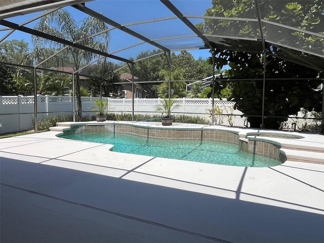 702 Palenci Ct, Winter Springs, FL 32708 - view of pool featuring a fenced backyard, a pool with connected hot tub, a patio area, and glass enclosure